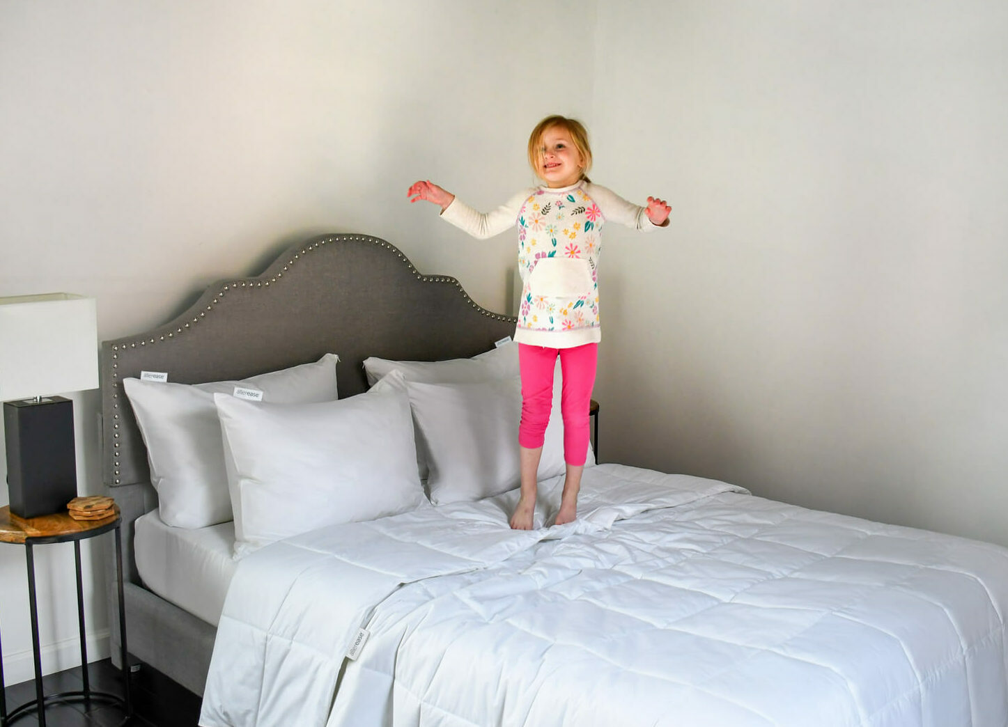 Little girl jumping on the bed